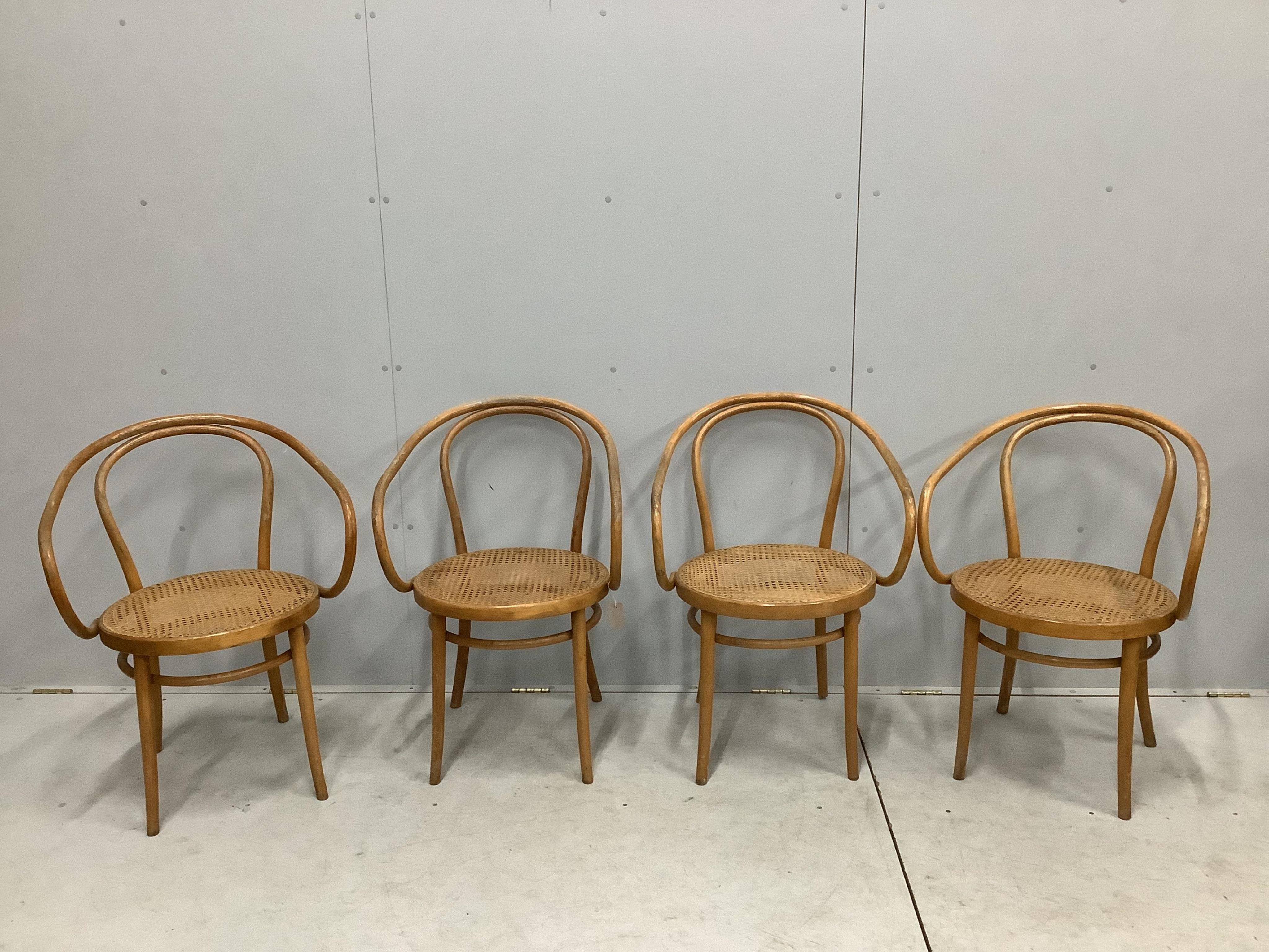 A set of four Thonet bentwood cane seat chairs, model no. 209, width 58cm, depth 48cm, height 84cm. Condition - fair